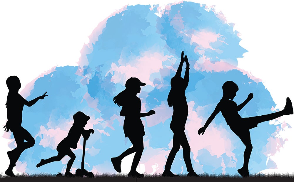 Silhouette of children frolicking on the grass